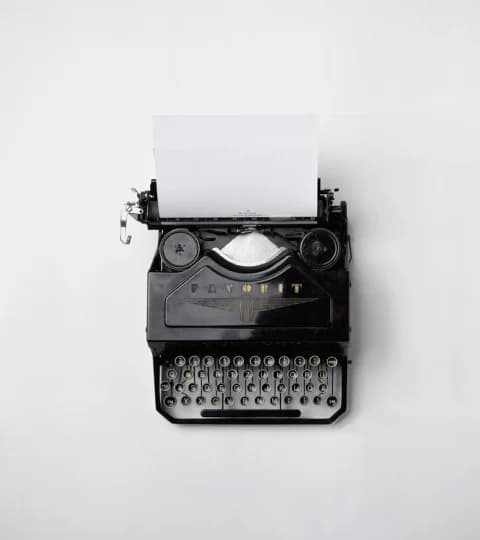 Vintage typewriter with a blank sheet of paper